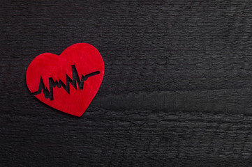 Heart against wooden background. World Health Day Concept