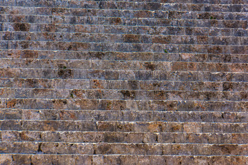 historic stone wall carved and laid by the Mayans in construction of temples 
