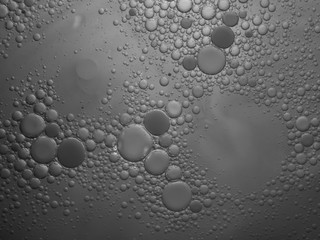 Abstract bubble background in grey. Slightly blurred and selective focus.