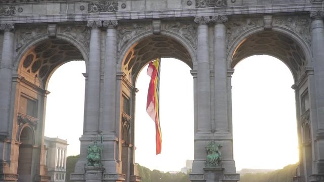 Belgium flag against tricolour stripes waving on wind from Arcade du Cinquantenaire 1920X1080 HD footage (1080p 100fps FullHD video)