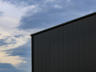 Obraz premium Low angle view of warehouse against evening sky