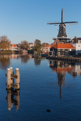 Fototapeta na wymiar View on famous De Adriaan at Haarlem, the Netherlands over the Spaarne river.