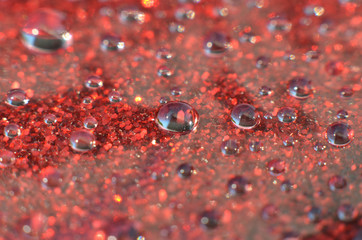 shiny clear water point attached to a glass reflects the same color as the color on the glass into a beautiful background as decoration