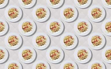 Obraz na płótnie Canvas plate with pasta on a light beige background pattern