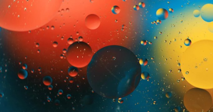 Abstract colorful background. Drops of oil in water. Rainbow colors