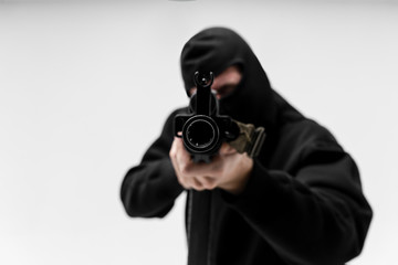 Man in mask With gun on white background