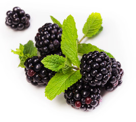 Blackberry with  mint leaves isolated on white