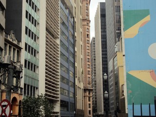 Vision at the beginning of Libero Badaro Avenue in Sao Paulo. Sun day with many buildings and big city life.