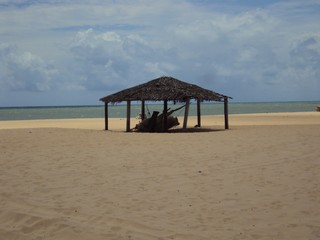 Fototapeta na wymiar Hut on the deserted Gostoso beach in São Miguel do Gostoso in Rio Grande do Norte.