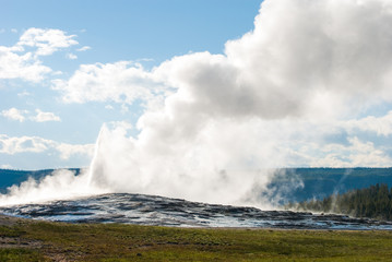 The famous Old Faithful Geyser in Yellowstone National Park after an eruption