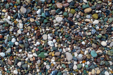 bright colored pebbles on the seashore