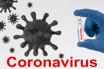 A blue-gloved hand holds an ampoule of coronavirus vaccine labeled 