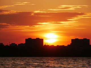 Lake at sunset, on a background of trees. Reflection of nature in the lake. Diamond Lake Kiev, Ukraine.