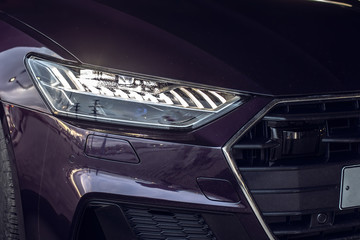 Laser and matrix headlights of a premium car. Close-up.