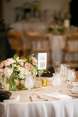 Wedding ceremony setting for a celebratory dinner iin pinks and white
