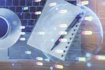 Double exposure of technology theme drawing over work table desktop. Top view. Global data analysis concept.