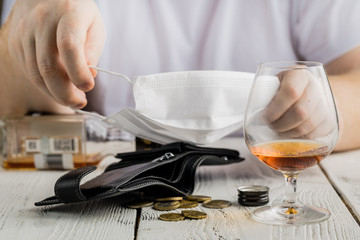 Man with alcohol Wearing Medical Mask. Corona Virus Concept