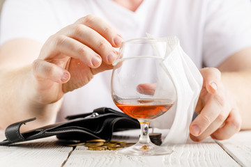 Adult man drink alcohol home quarantine caused by coronavirus
