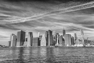 Lower Manhattan buildings and East River reflections, New York City, USA