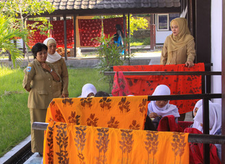 Girls painting in batik school in Mataram Lombok