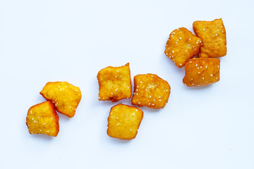 Chinese deep fried dough sticks with white sesame seeds.