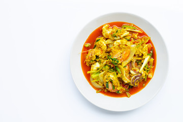 Fried seafood with curry powder on white