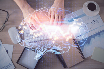 Double exposure of man's hands typing over computer keyboard and brain hologram drawing. Top view. Ai and data technology concept.