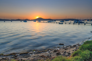 Sunrise and a light haze over the Bay