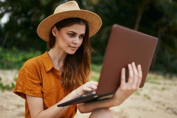 Woman tourist chatting laptop island vacation