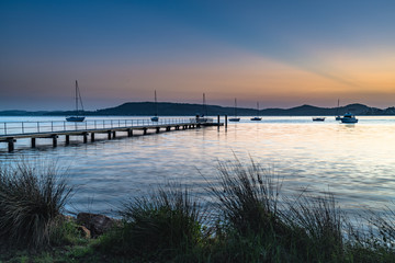 Fototapeta premium Sunrise and a light haze over the Bay