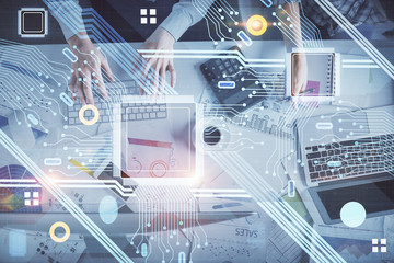 Double exposure of man and woman working together and data theme hologram drawing. Computer background. Top View.
