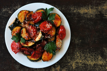 Zucchini with vegetables on a plate. Healthly food. Vegan diet. Cooking at home.