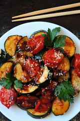 Zucchini with vegetables on a plate. Healthly food. Vegan diet. Cooking at home.