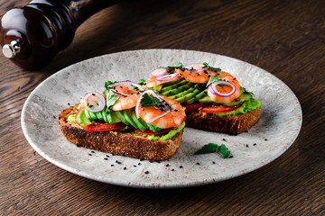 fried shrimp on toast bread with avocado