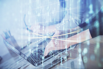 Double exposure of woman hands working on computer and data theme hologram drawing. Tech concept.