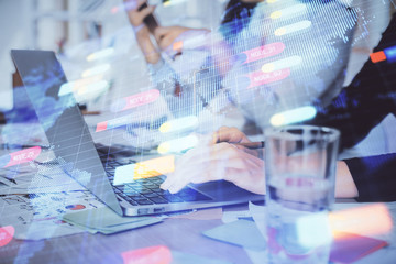 Double exposure of woman hands working on computer and data theme hologram drawing. Tech concept.