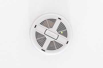 Ceiling mounted white colored mains powered smoke detector