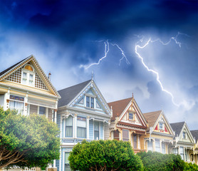 The Painted Ladies of San Francisco Alamo Square Victorian houses with storm approaching.