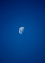 full moon over blue sky