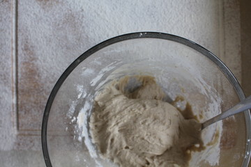 Rye Buckwheat dough rising in a bowl with a flour board dusted and used for baking