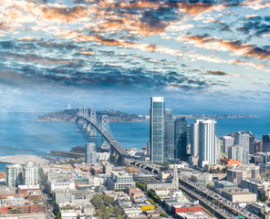 Aerial view of San Francisco main road and Bay Bridge with city skyline