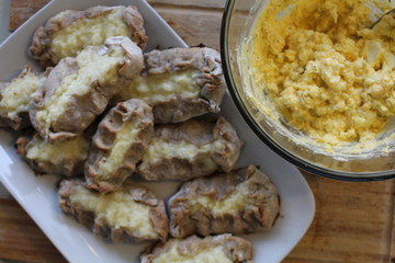 Cooked Karelian pies - Pirakka on a baking sheet. Dish of national cuisine - piirakka. Close-up.