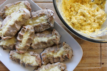 Cooked Karelian pies - Pirakka on a baking sheet. Dish of national cuisine - piirakka. Close-up.