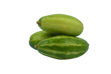 Three fresh green colored pointed gourd stacked on a white background