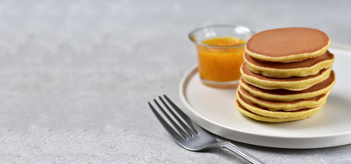 pancakes with lemon jam on a white craft plate. family Breakfast dish, food for children in the morning.  pancake recipe. food delivery gluten free pancakes