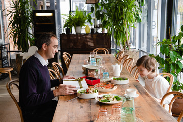 Family of two enjoying time together in a cafe