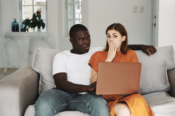 young couple using laptop