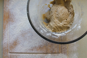 Rye Buckwheat dough rising in a bowl with a flour board dusted and used for baking