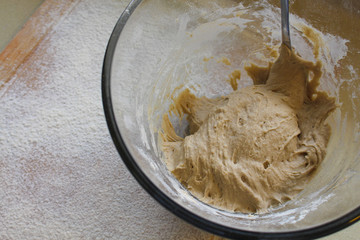 Rye Buckwheat dough rising in a bowl with a flour board dusted and used for baking