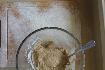 Rye Buckwheat dough rising in a bowl with a flour board dusted and used for baking